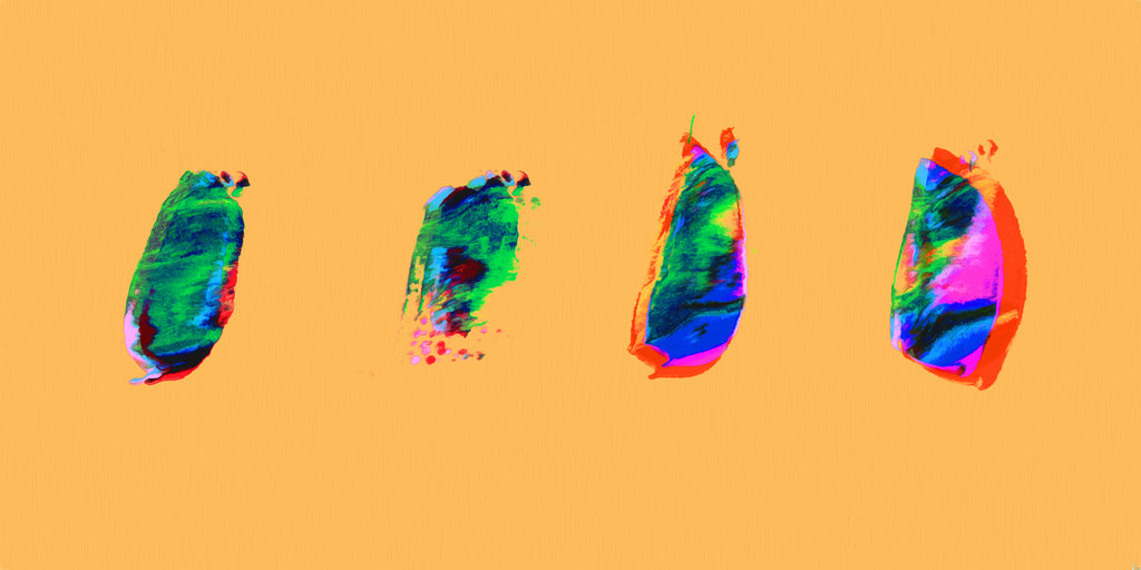 Four abstract paint-splatter shapes in bright green, blue, pink, and red on a solid orange background.