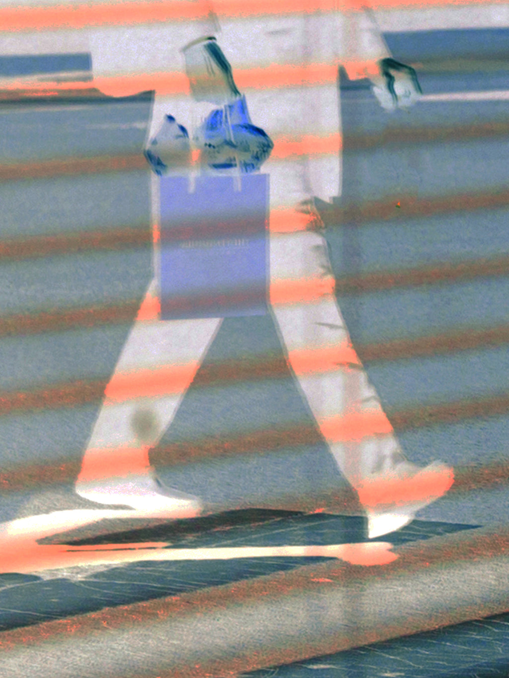 A double-exposure style photograph showing a blurred pedestrian crossing a street, with horizontal orange-red light streaks overlaying a faint figure.