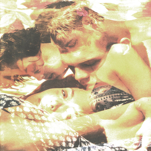 A warm-toned, close-up photograph of three people lying together, with one person in a patterned bra and another in a floral top. The image has a heavily filtered, vintage aesthetic with strong yellow and orange hues.